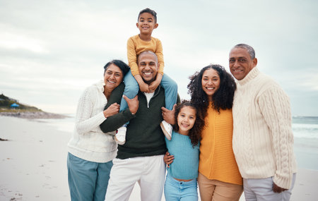 Portrait, love and family on beach, vacation and break for wellness, happiness and confidence. Face, grandparents and mother with father, children and cheerful on seaside holiday, happy and relaxの写真素材