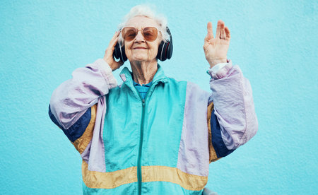 Happy, elderly and woman with headphone music for wellness, fun and retirement leisure. Urban, retro...