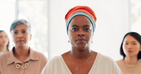 Team, business women and walking in office building with focus, global company and empowerment. Diversity, female teamwork and walk in startup for motivation, mindset or solidarity of visionary goalsの写真素材