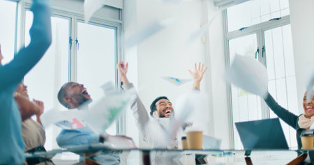 Celebration, teamwork and business meeting with documents in the air with motivation. Diversity,...