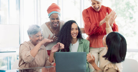 Success, applause and team at laptop with black woman at startup business and email or office...