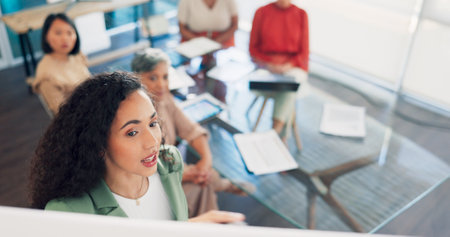Black woman, leadership presentation and business meeting in modern office for training, team coaching and planning strategy. African girl, creative leader and teamwork collaboration or discussionの写真素材