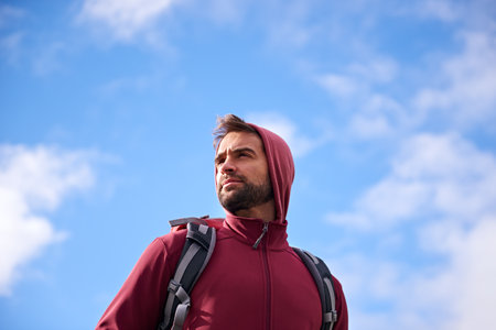 The mountain is my gym. a young man enjoying a hike through the mountains.の写真素材