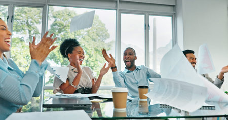 Celebration, teamwork and business meeting with documents in the air with motivation. Diversity,...