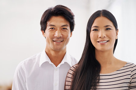 Their careers are looking promising. Cropped portrait of two smiling asian business colleagues.の写真素材