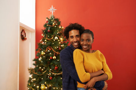 The perfect Christmas couple. Cropped portrait of a loving young couple on Christmas.の写真素材