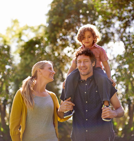 Spending a family day together. a happy family walking together outside.