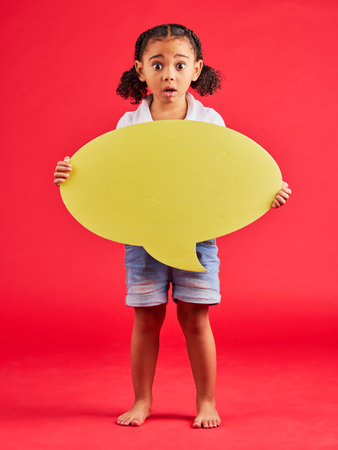 Shocked, child or portrait of speech bubble ideas, opinion or vote on isolated red background in social media news or wow face. Surprised, girl or kid on banner paper, mockup poster or omg reviewの写真素材
