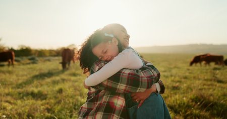 Agriculture, cows and mother hug child for sustainability farming, animal care and love on sky lens flare mock up. Sustainability family with group cattle for beef, meat or food supply chain industryの写真素材