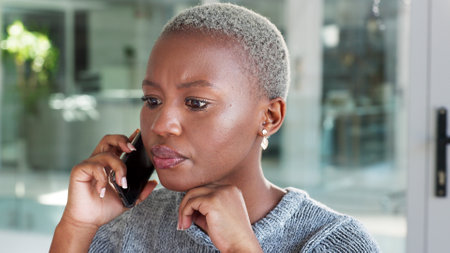 Phone call, business woman and laptop planning in a corporate office with black employee talking to client. Time management, schedule and professional face of African American planner enjoying careerの写真素材