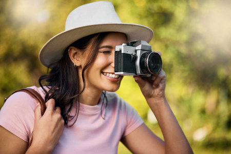 Photography, smile and woman with a camera in nature during travel in Singapore. Vacation, tourism...