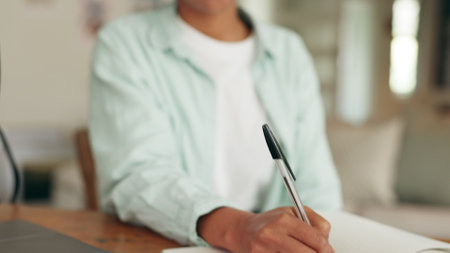 Radio broadcast, notebook planning and presenter writing news while live streaming, talking on podcast and discussion with online audience. African speaker streaming during conversation on internetの写真素材