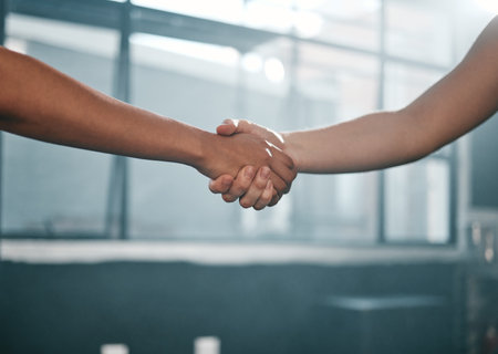 Fitness, partnership or people handshake at gym for team work, trust or support after workout or exercise. Community, friends or healthy sports athletes shaking hands after training collaborationの写真素材