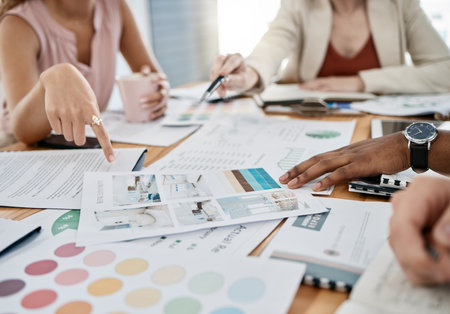 Hands, accounting and documents with a business team planning in collaboration for growth in an office. Finance, data and teamwork with a man and woman employee group working on a financial budgetの写真素材