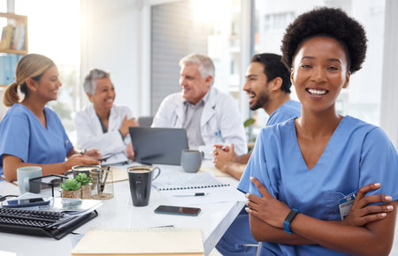 Portrait, happy black woman or nurses in meeting for a strategy or working in hospital for healthcare together. African, smile or group of doctors talking, planning or helping innovation or ideasの写真素材