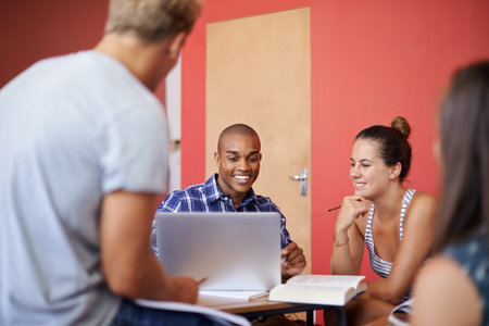 Taking time out from studying. a group of university students studying together.