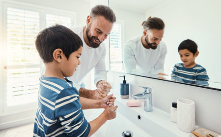 Cleaning, washing hands and father with boy in bathroom for hygiene, wellness and healthcare at...