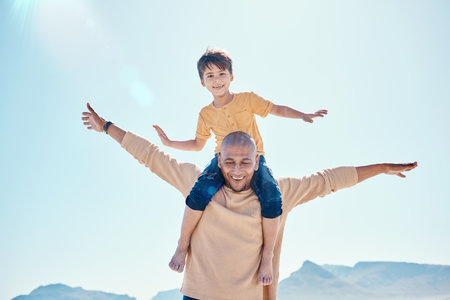 Family, beach and father with boy on shoulder by ocean for bonding, quality time and relaxing on weekend. Travel, smile and happy dad holding child on summer holiday, vacation and adventure togetherの写真素材