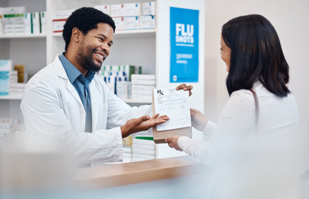Pharmacy, counter and pharmacist with medicine for customer for wellness, drugs and medical prescription. Healthcare, clinic service and happy black man with client for medication, pills and packageの写真素材