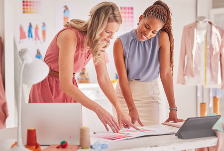 Business people, fashion and design in team strategy, planning or decision on office table at workshop. Employee designers in business discussion, brainstorming or idea for clothing choice at workの写真素材