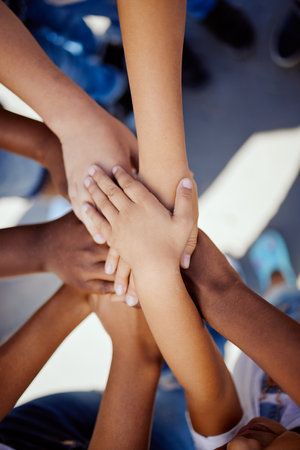 Hands, together and support, children solidarity and trust, commitment and team motivation top view. Diversity, teamwork and youth group with development, growth and kids community with connectionの写真素材