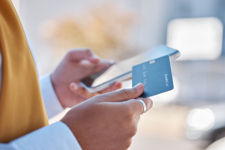 Woman hands, credit card and phone online shopping, ecommerce or financial payment on 5g cellphone or web 3.0. Young person outdoor on smartphone for fintech, digital mobile app and banking servicesの写真素材