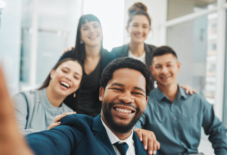 Selfie, portrait and business people smile for photo, profile picture or social media homepage update. Team, face and friends relax, happy or pose for pictures while having fun and bonding in officeの写真素材