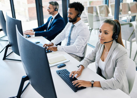 Diversity, call center and customer support team or people with telemarketing, contact us and consulting worker working. Consultant, communication and happy insurance service employee with headset.の写真素材