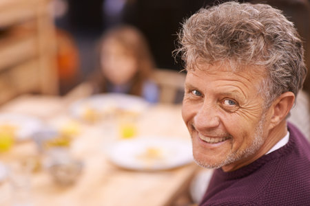Its always been my favorite meal of the day. Cropped portrait of a senior man enjoying breakfast with his family.の写真素材