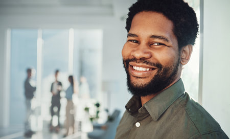 Face portrait, business smile and black man in office with mission and success mindset. Ceo, boss and happy, confident and proud male entrepreneur from Nigeria in professional company or workplaceの写真素材