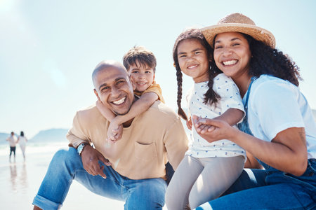 Family, portrait and smile at beach on vacation, having fun and bonding together. Holiday, relax and care of happy father, mother and kids or children by seashore enjoying quality time outdoors.の写真素材