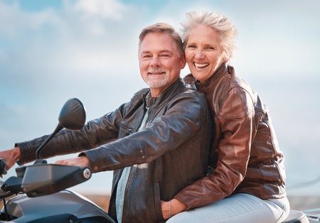 Travel, motorcycle and portrait of senior couple on road trip, adventure and enjoy freedom in retirement. Smile, traveling and happy man and woman ride on motorbike for holiday, vacation and journeyの写真素材