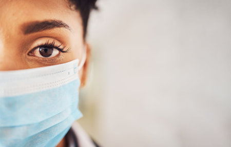 Mockup, closeup and portrait with black woman, mask and protection against illness, virus and sickness. Face cover, African American female and lady with safety, healthcare and medical regulationsの写真素材
