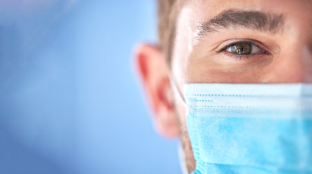 Covid 19 portrait, half face mask and doctor for pandemic security risk, hospital healthcare support or clinic mockup. Corona virus safety, medical nurse eyes or man for health care, wellness or helpの写真素材