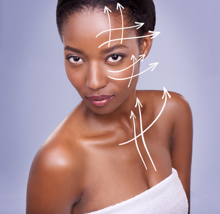 Skin any woman would want. a beautiful african woman against a purple background.の写真素材