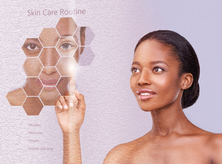 In touch with skincare. a beautiful african woman against a purple background.の写真素材