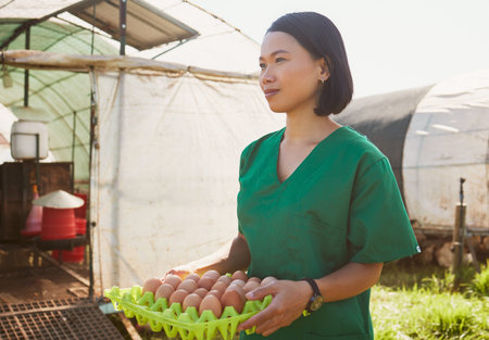Vet healthcare, farm and woman with egg for quality control, health inspection and check organic...