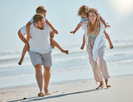 Freedom, travel and piggyback with family on beach for summer break, happiness and bonding on vacation. Tropical, destination and support with parents playing with children on trip for Cancun holidayの写真素材