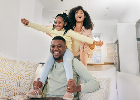 Portrait, love and black family on couch, quality time and happiness for bonding, loving and playing on weekend break. Face, parents and mother with father, female kid and child on sofa, smile or joyの写真素材