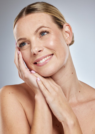 Skincare, woman beauty and facial wellness of a model looking happy about dermatology treatment. Skin glow, face shine and luxury cosmetics of a female with happiness from self care or spa wellbeingの写真素材