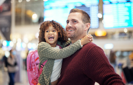 Family, father and kid hug at airport, travel and girl with man excited for flight, happiness and love and ready at terminal. Happy, care and bond with smile, backpack and vacation with transportの写真素材