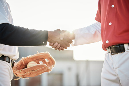 Baseball, sports or handshake for team greeting, introduction or respect on stadium field together. Zoom of men shaking hands in softball match or game in competition, training or workout exerciseの写真素材