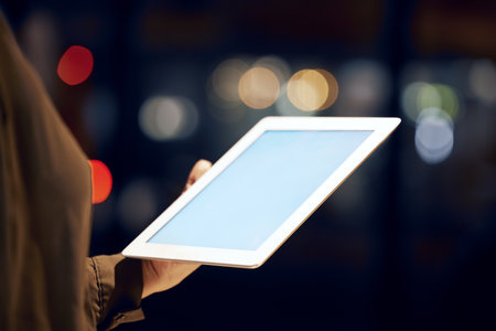 Tablet mockup, hands or night with screen and woman, business advertising or customer experience insight. Brand monitoring ui, product placement research or person with social network spaceの写真素材