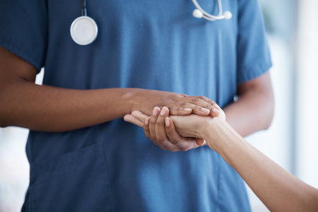 Hope, black woman or nurse holding hands in hospital consulting for medical test news or results for sympathy. Empathy, trust or zoom of doctor in healthcare clinic nursing or helping sick patientの写真素材