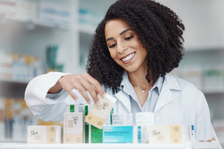 Pharmacy, medicine and smile with woman in store for healthcare, drugs dispensary and treatment prescription. Medical, pills and shopping with pharmacist for check, label information or productの写真素材