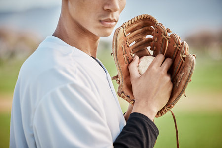 Man, baseball player or hands glove on field, sports or arena grounds for game, match or competition throw. Zoom, athlete or softball mitt for pitcher, fitness exercise or training workout in stadiumの写真素材