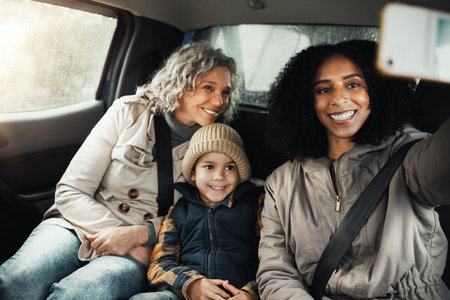 Selfie, smile and family on a road trip in a car for bonding, quality time and a getaway together. Happy, travel and mother, grandmother and a child taking a photo on vacation for social mediaの写真素材