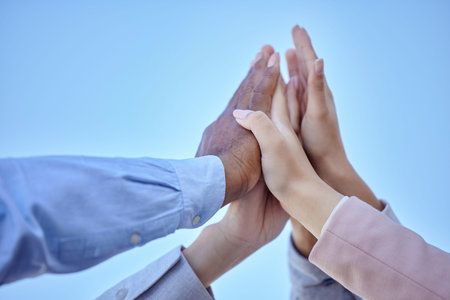 Success, high five and teamwork with hands of business people for community, diversity and support. Solidarity, winner and collaboration with group of friends for goals, motivation and celebrationの写真素材