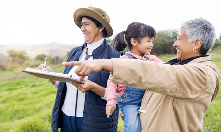 Senior farmer women, checklist and field at family farm, laugh and bonding love with girl kid outdoor. Old woman, child and writing in countryside, farming and happiness in nature with landscapeの写真素材