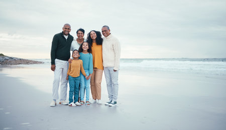 Portrait of grandparents, parents and children on beach enjoying holiday, travel vacation and weekend together. Big family, love and happy group smile for bonding, quality time and relax by oceanの写真素材